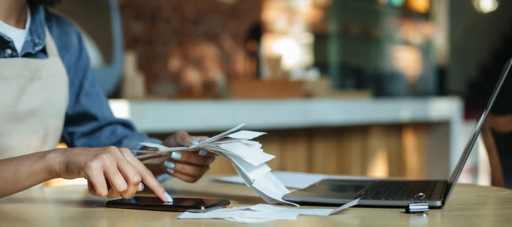 cafe worker entering receipts