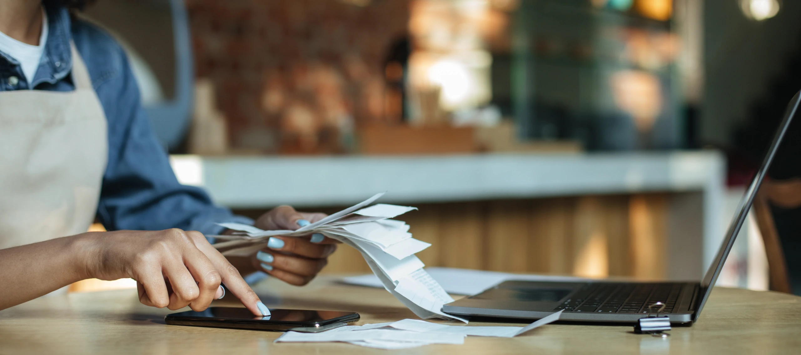cafe worker entering receipts